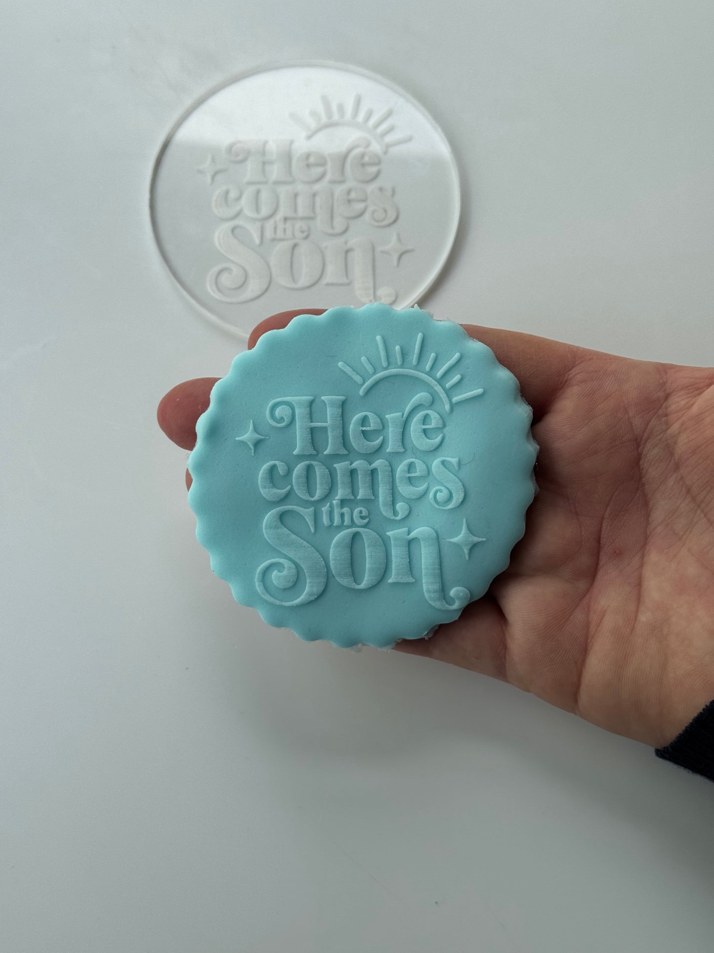 Here comes the son - sun - deboss