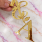 Personalised Initials Gold Mirror Acrylic Cake Topper with Botanical Leaf Design