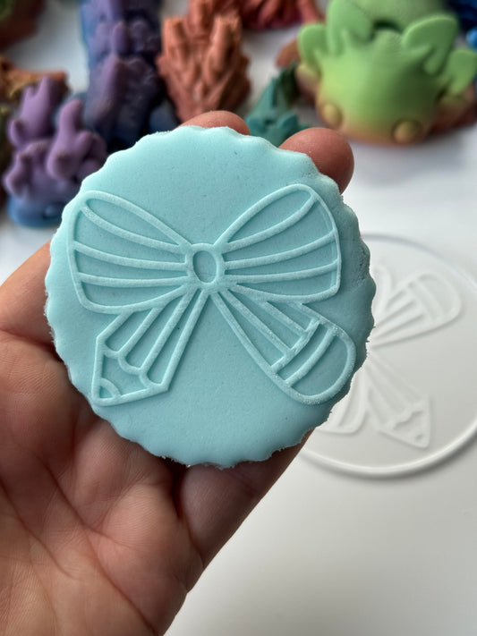 Pencil bow deboss disc